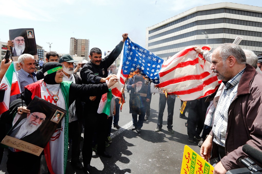 Demonstrators burn a US flag in Tehran, Iran. Tension between the town countries is at breaking point after the US killed a top Iranian military commander in an air strike. Photo: EPA