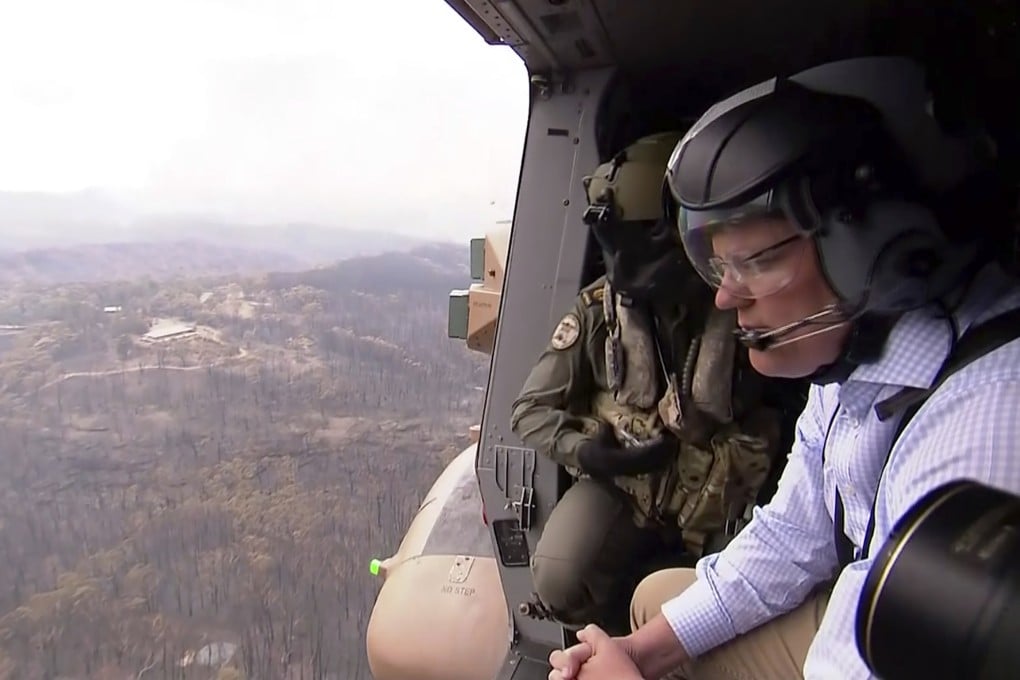 Australia's Prime Minister Scott Morrison looks at fire damage from an Australian Army helicopter. File photo: AP