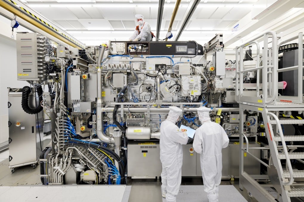 ASML employees are seen working on the final assembly of the company’s Twinscan NXE: 3400B extreme ultraviolet semiconductor lithography machine, with its panels removed, in Veldhoven, the Netherlands, on April 4, 2019. Photo: Reuters