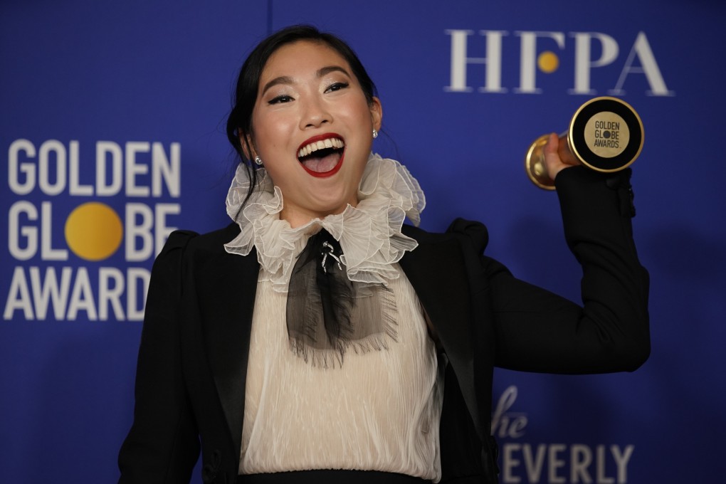 Awkwafina poses backstage with her award. Photo: Reuters