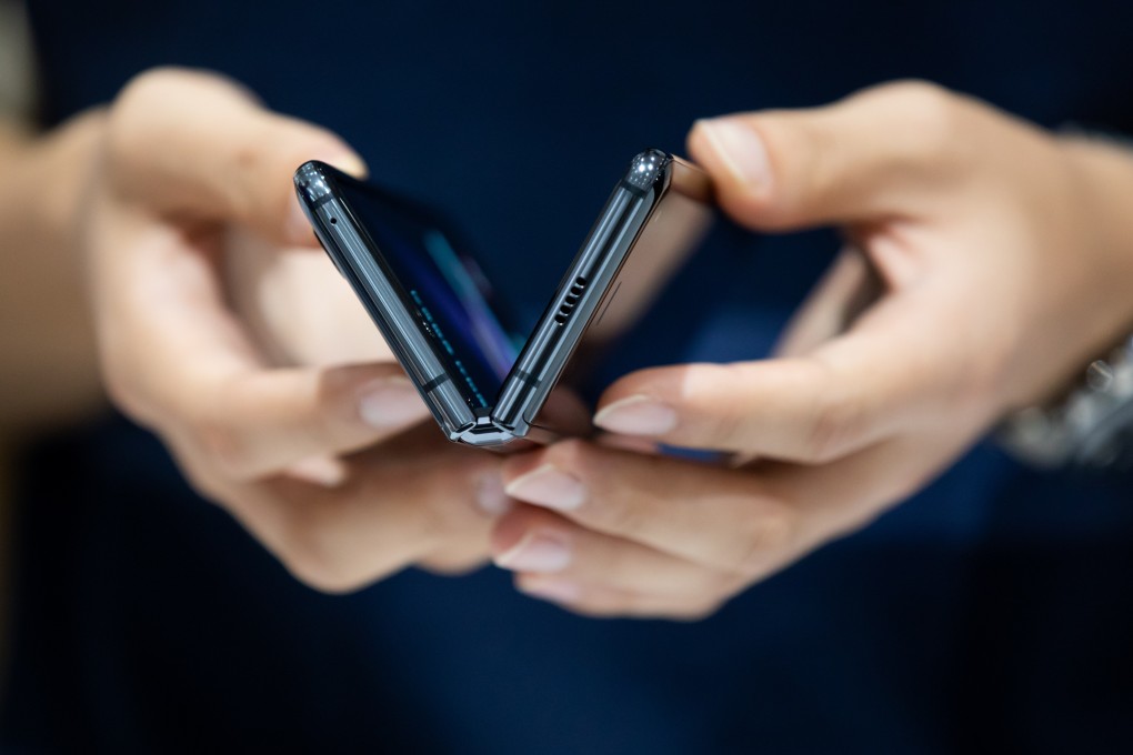 A customer tries out a Samsung Electronics Galaxy Fold smartphone in Seoul, South Korea in September 2019. File photo: Bloomberg