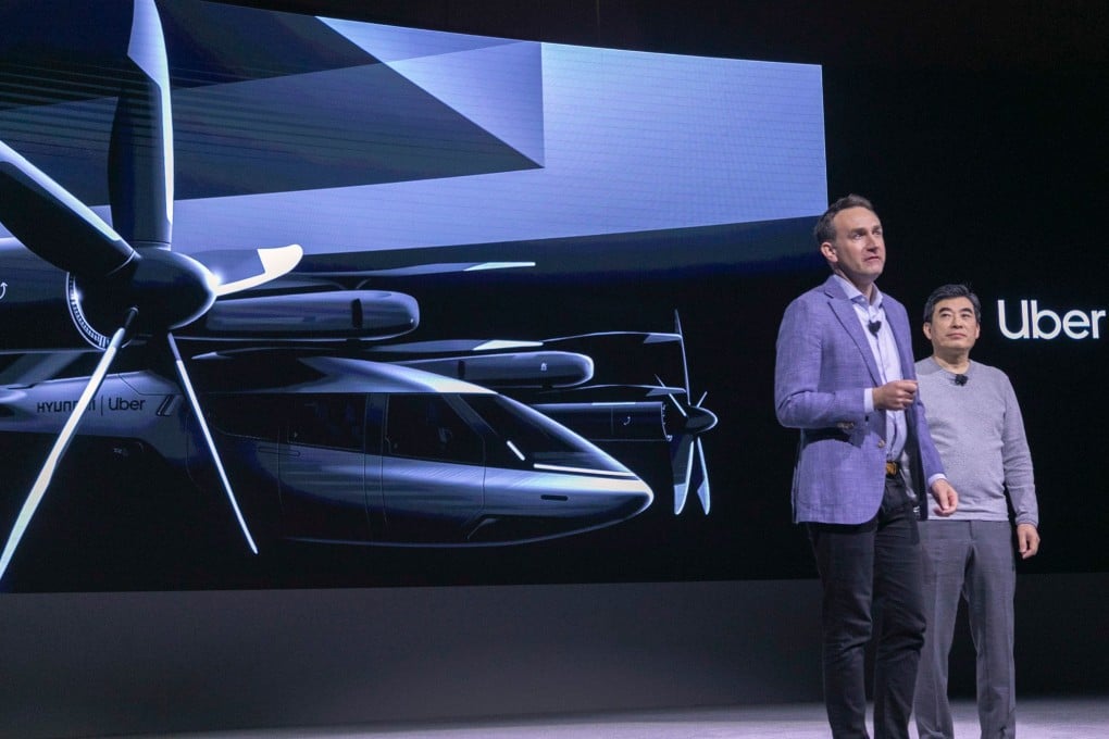 Eric Allison (L), Head of Uber Elevate, and Jaiwon Shin, Head of Urban Air Mobility at Hyundai, talk about the S-A1 electric vertical takeoff and landing (eVTOL) aircraft at the 2020 CES in Las Vegas, Nevada, on January 6, 2020. Photo: AFP