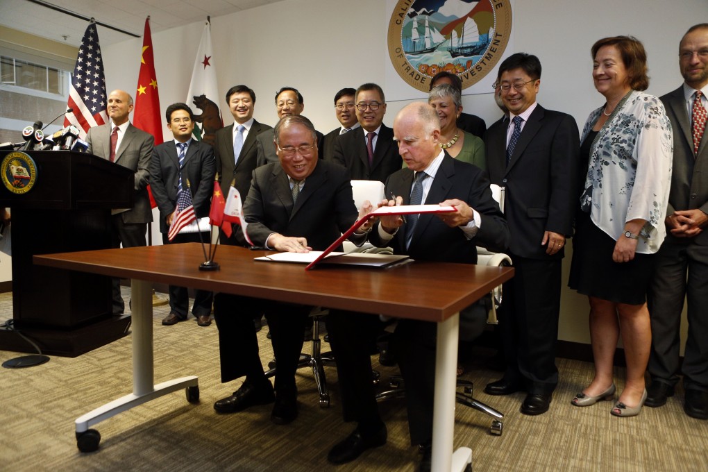 California’s then governor Jerry Brown (seated right) and Xie Zhenhua, then vice-chairman of China’s National Development and Reform Commission, sign an agreement to boost bilateral cooperation on climate change, at the Bay Area Council in San Francisco in September 2014. Photo: AP