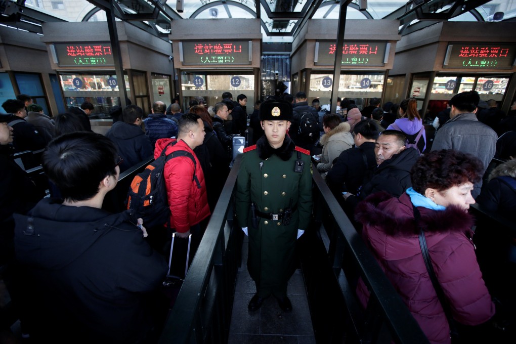 Passengers at Beijing Railway Station during last year’s Lunar New Year travel period. Photo: Reuters