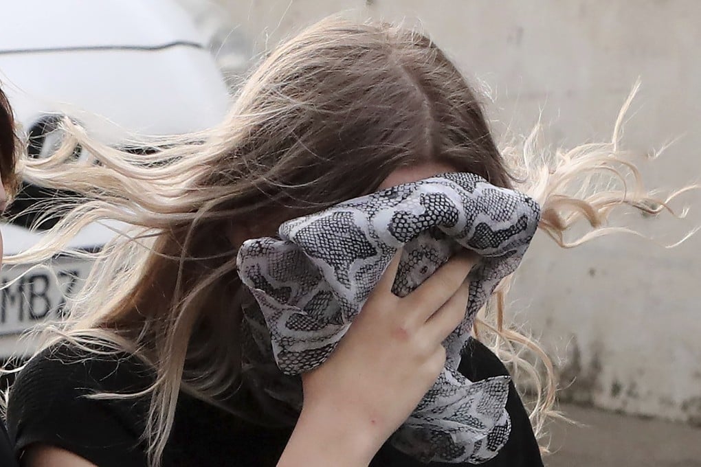 A 19 year-old British woman, who was found guilty of claiming she was raped by up to 12 Israelis, arrives at court before being given a suspended sentence. Photo: AP