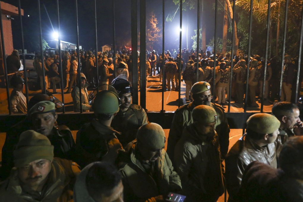 Police arrive at the Jawaharlal Nehru University in New Delhi, India, after masked assailants beat students and teachers with sticks. Photo: AP