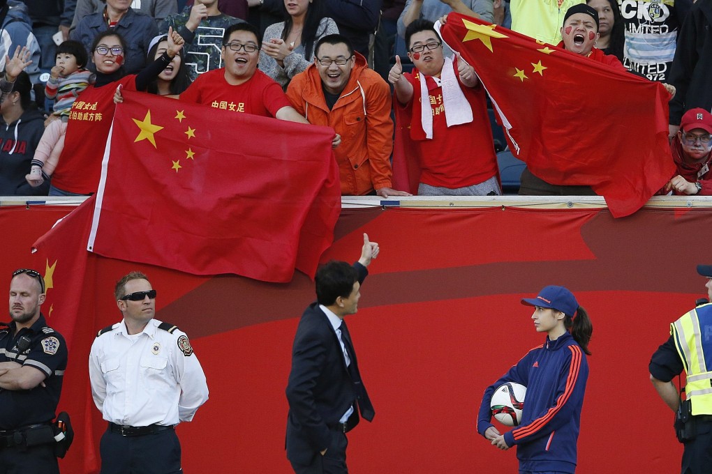 China head coach Wei Hao gives a thumbs up to supporters after being sent off at the Fifa Women’s World Cup in 2015. Photo: AP