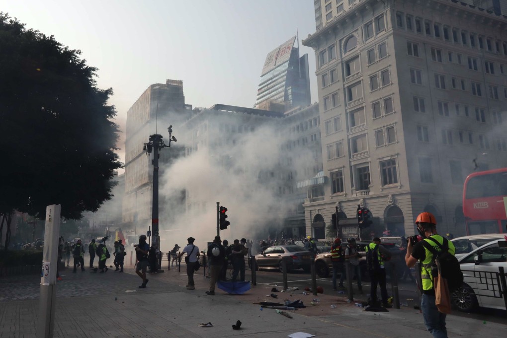 Anti-government protesters clash with anti-riot police outside The Peninsula, Tsim Sha Tsui, on October 27, 2019. Photo: Felix Wong
