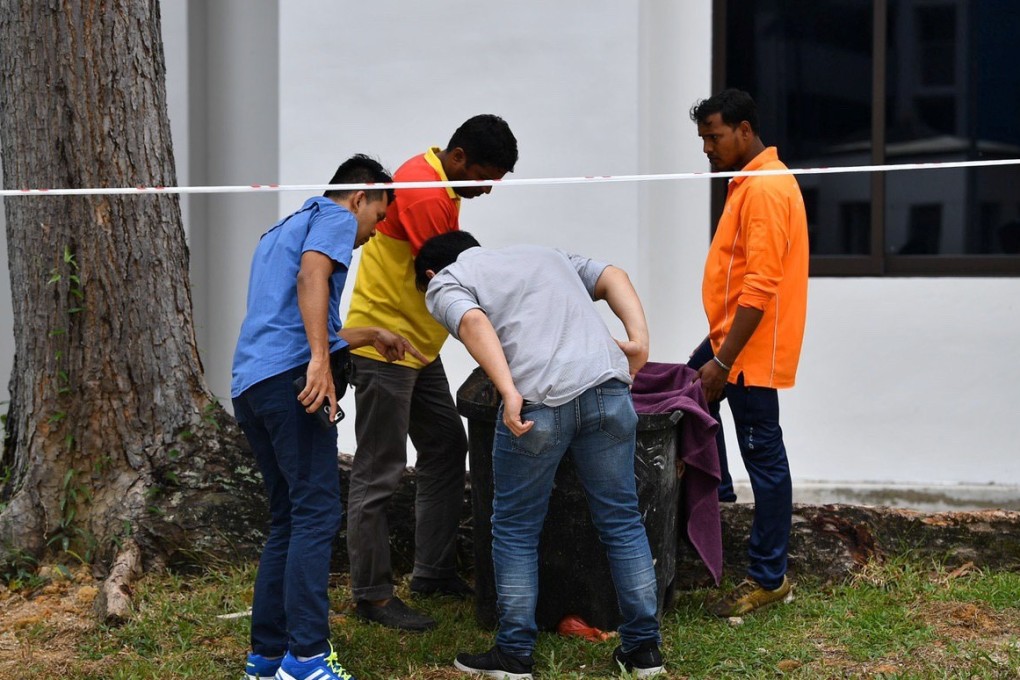 An abandoned baby was found alive in a trash bin in Singapore. Photo: Reuters/The Straits Times
