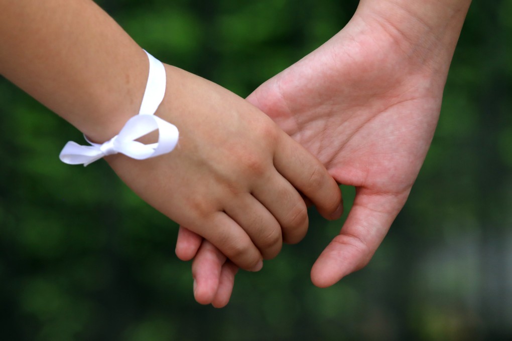 Two protesters join hands to form a human chain with others, during a rally in Tai Po, Hong Kong, last September. The Cantonese-centred localism that has fuelled Hong Kong’s anti-government protests since the 2014 “umbrella movement” targets mainland Chinese and does not address other minorities. Photo: K. Y. Cheng