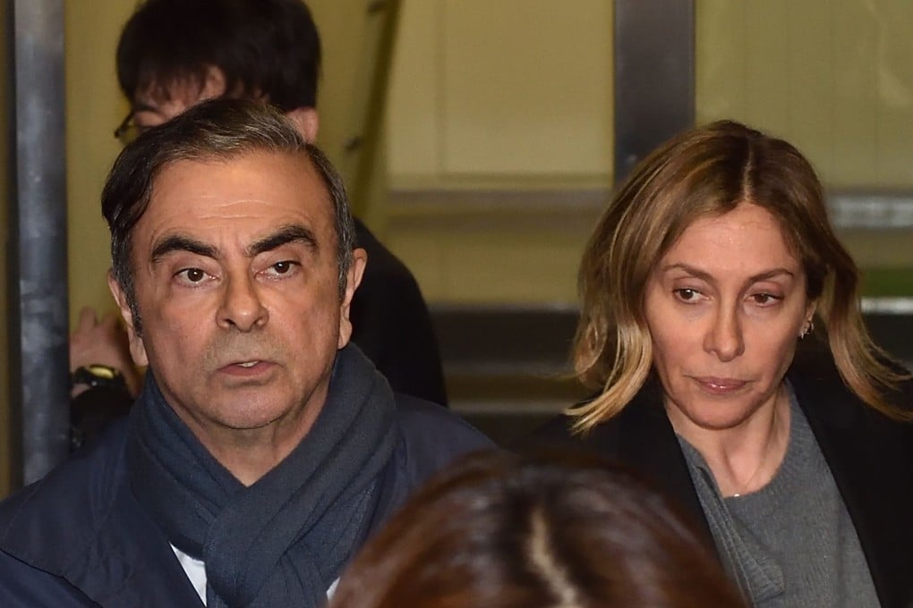 Former Nissan chairman Carlos Ghosn and his wife Carole leave the office of his lawyer in Tokyo after his arrest in April 2019. Japanese prosecutors have issued an arrest warrant for Carole. Photo: AFP