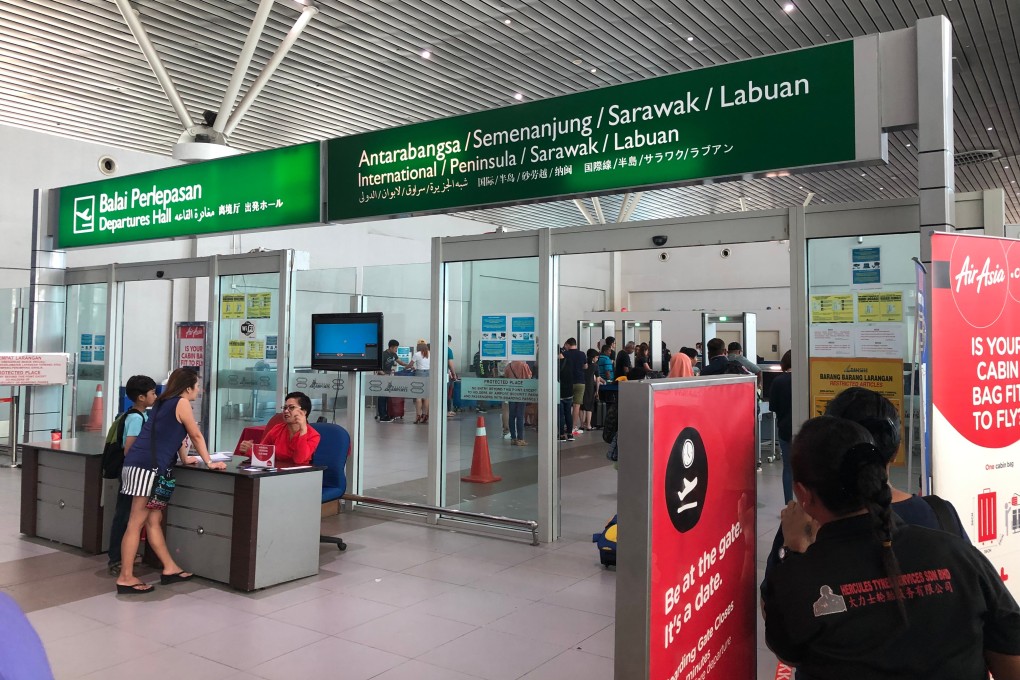 Among the measures being considered to prevent any further incidences of tourists entering Malaysia without a stamped travel document include increasing the size of Chinese script on signs at Kota Kinabalu International Airport. Photo: Shutterstock