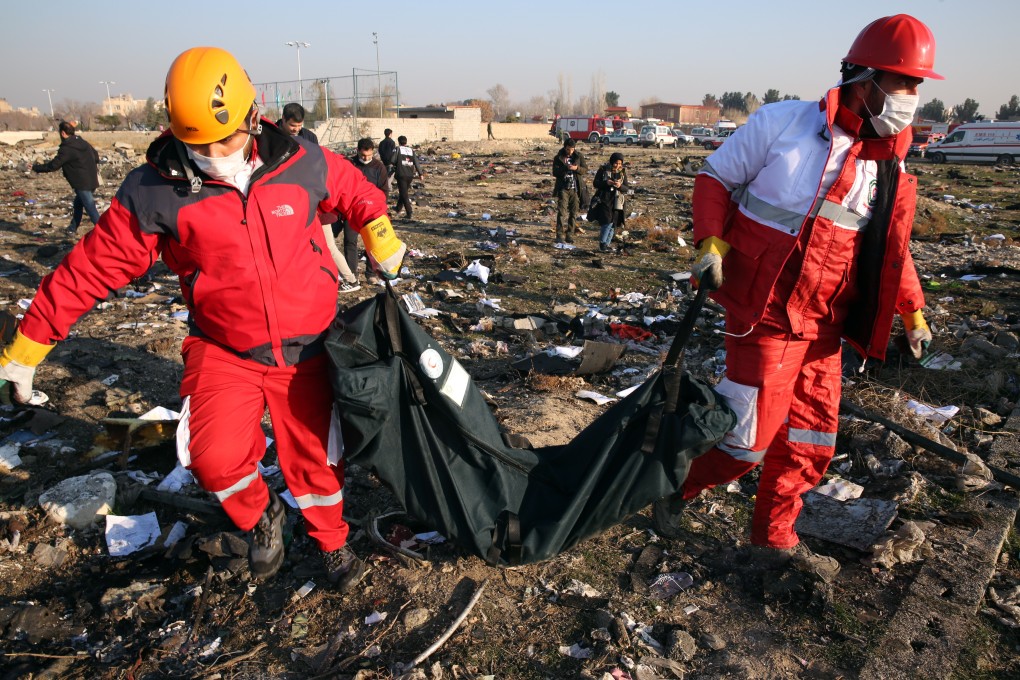 Members of the International Red Crescent work at the site of the wreckage in Shahriar, Iran, on January 8, 2020. Photo: EPA-EFE