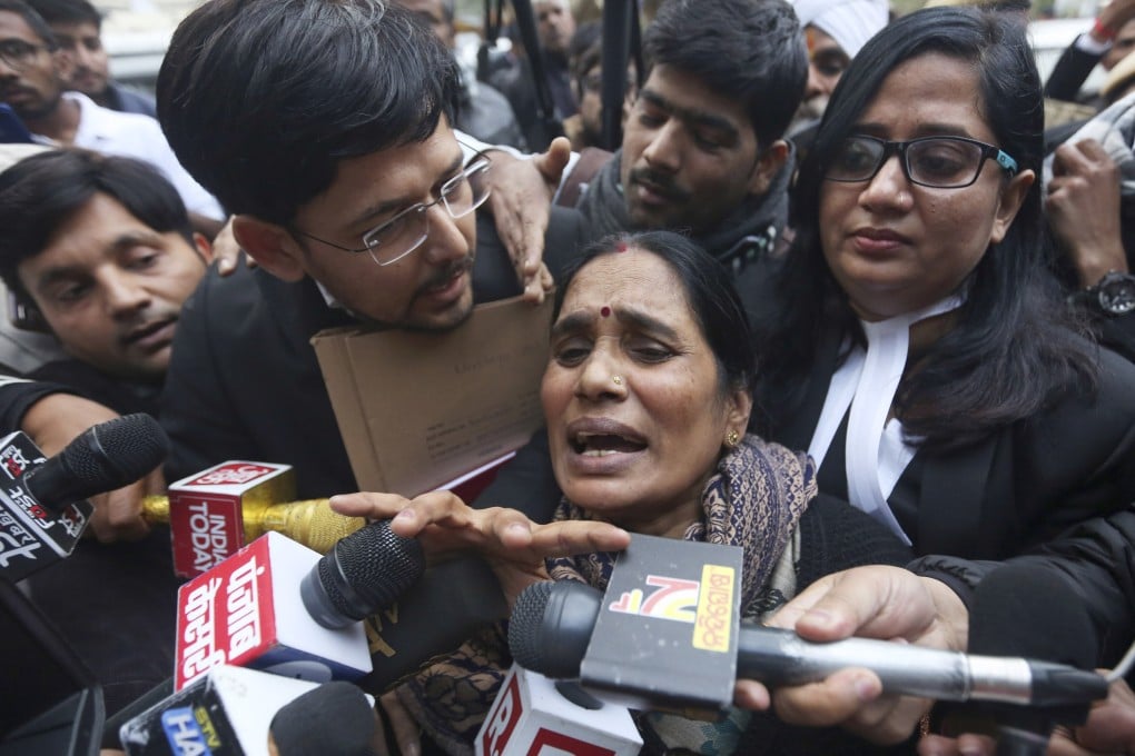 The mother of the victim of the fatal 2012 gang-rape on a New Delhi bus speaks to the media after a court scheduled the executions of the four men convicted of the crime. Photo: AP
