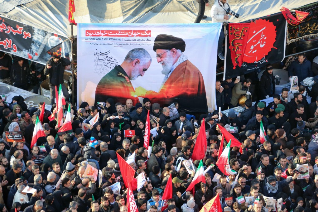Iranian mourners carry a picture of Iran's Supreme Leader Ayatollah Ali Khamenei granting the Order of Zolfaghar, the highest military honour of Iran, to General Qasem Soleimani, during the latter's funeral procession in Tehran. Photo: AFP