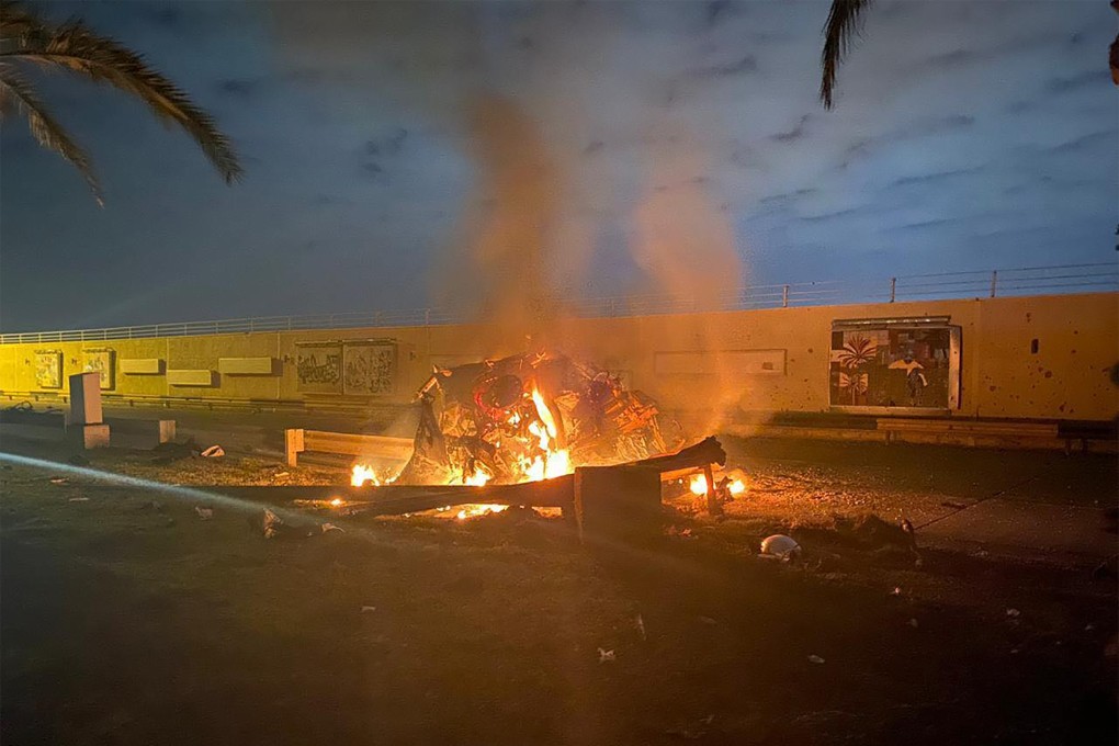 Burning wreckage after the air strike near Baghdad airport early on Friday. Photo: AFP