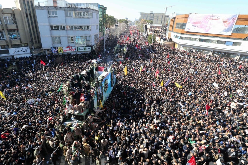 Iranian mourners gather around a vehicle carrying the coffin of slain top general Qassem Soleimani during a funeral procession in his hometown Kerman. Over 30 people were killed in a stampede during the procession. Photo: AFP