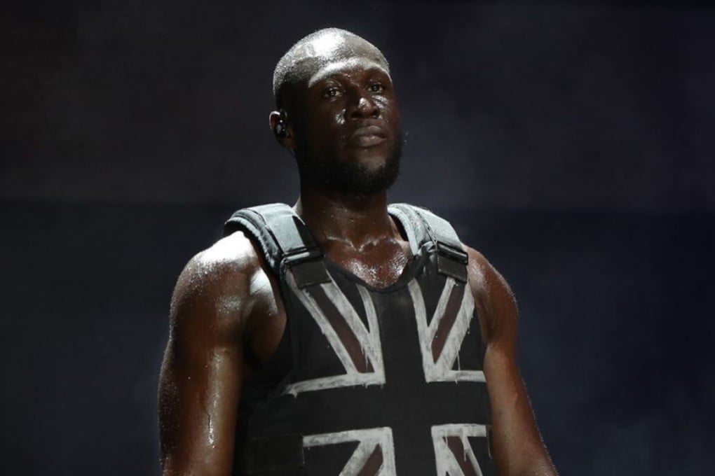 Stormzy performing in a stab-proof vest.