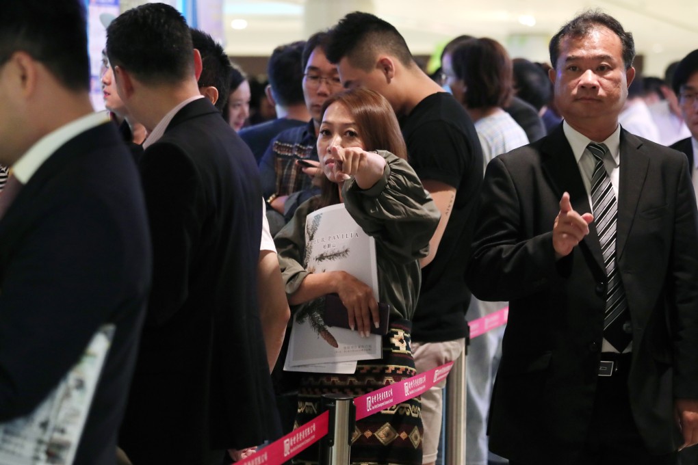 Potential buyers queuing to view the Fleur Pavilia luxury development at the New World Development's sales centre in Tsuen Wan in June 2018. Photo: Jonathan Wong