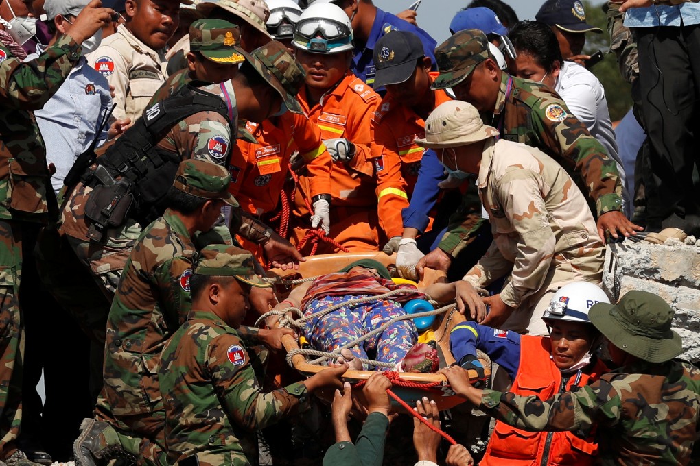 Rescuers after the collapse in Kep. Photo: Reuters
