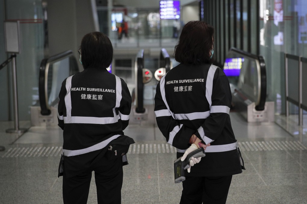 Health surveillance officers check passengers at entry ports to Hong Kong. Photo: AP