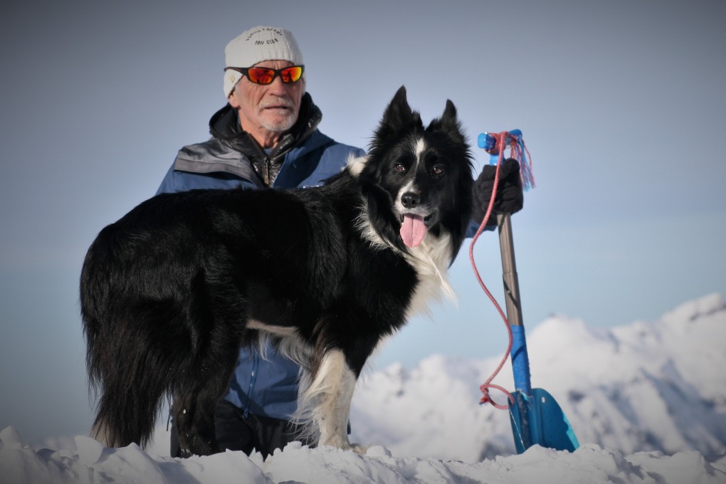 Guy Anciaux and his avalanche dog, seven-year-old Fly, undergo training. A dog can search in 30 minutes an area of snow it would take 20 people four hours to cover. Photo: Jean Michel Morlot/ANENA