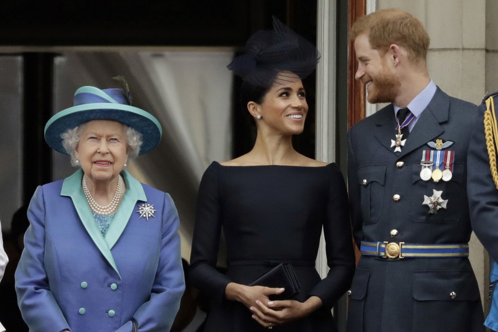 Britain's Queen Elizabeth, Meghan, Duchess of Sussex, and Prince Harry at Buckingham Palace in July 2018. Photo: AP