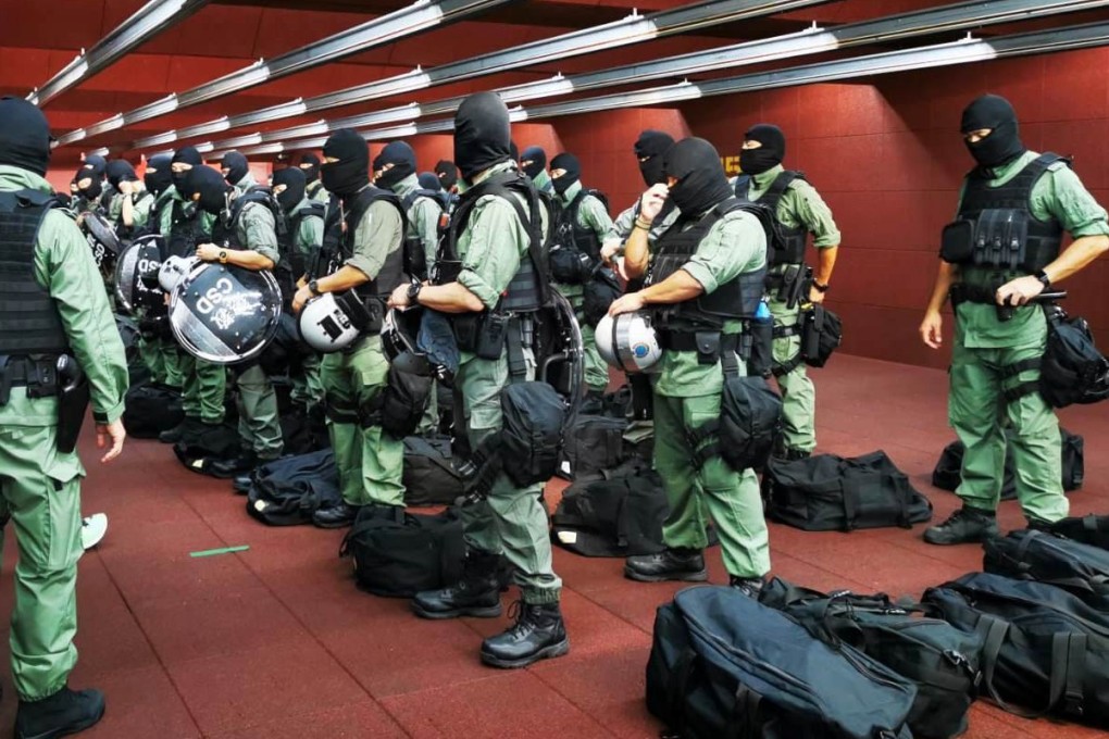 Officers from the Correctional Services Department suit up for their special constables duty. Photo: Handout