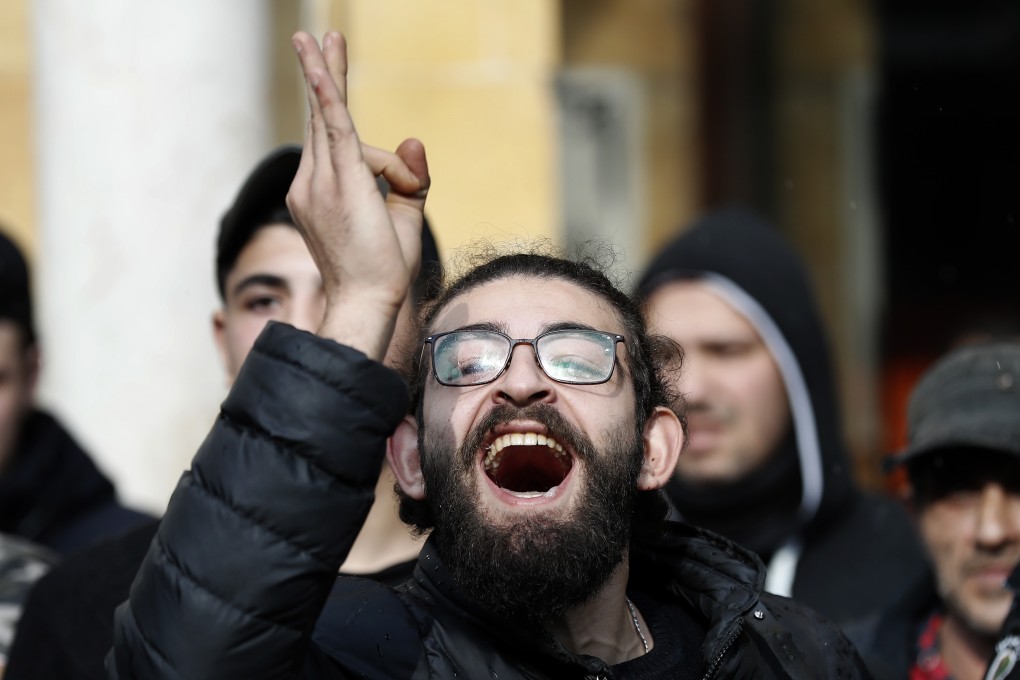 A supporter of outgoing Prime Minister Saad Hariri shouts slogans against the anti-government protesters. Photo: AP Photo