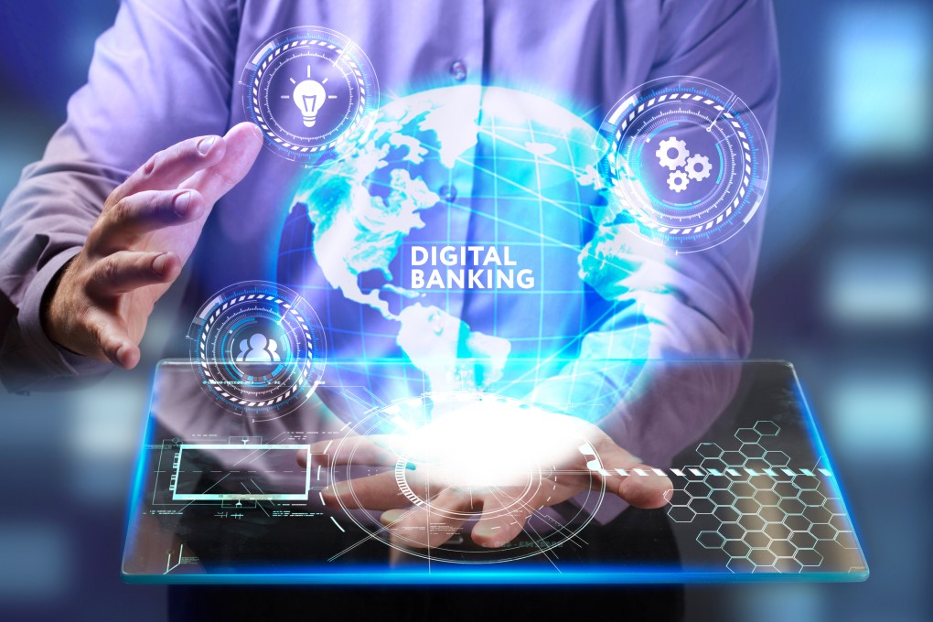The concept of business, technology, the internet and the network. A young entrepreneur working on a virtual screen of the future and sees the inscription: Digital banking. Photo: Shutterstock