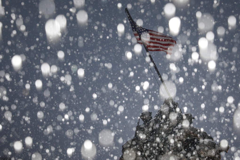 Snow falls during a storm at the Iwo Jima Memorial site in Arlington, Virginia. Photo: Reuters