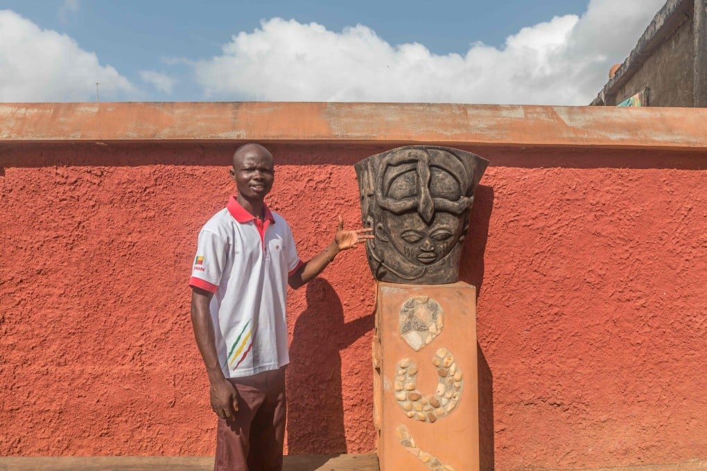 West African voodoo – known as vodun – is enjoying a revival in Benin, its place of birth. Messie Boko, a tourist guide, in a vodun square in Porto-Novo, Benin. Photo: Yanick Folly/AFP