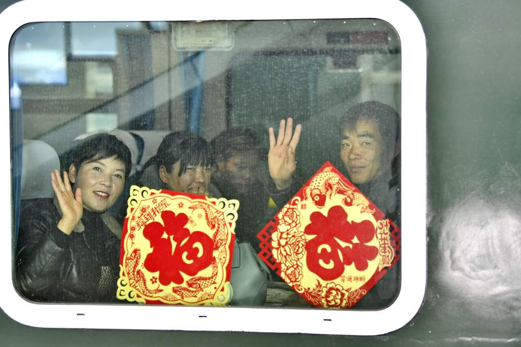 Passengers wavethrough the train window at the Lhasa Railway Station on January 10, 2020, the first day of the Spring Festival travel season. Photo: Xinhua