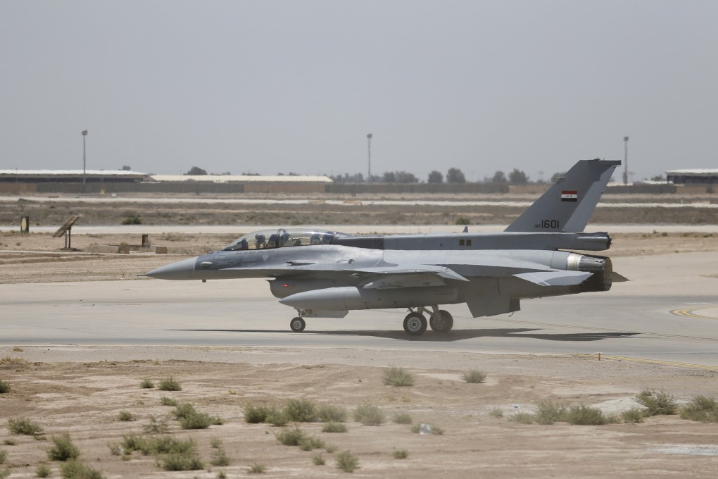 A US F-16 fighter jet is seen on the tarmac if a military base in Balad, Iraq. Photo: Reuters