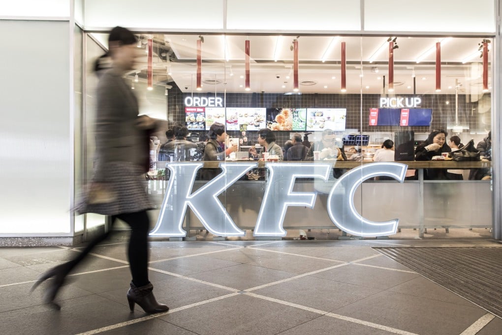 A woman walks past a Yum China Holdings Inc. KFC restaurant in Shanghai, China, on Tuesday, March 19, 2019. Photo: Bloomberg