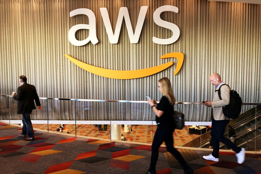 Attendees at Amazon’s annual cloud computing conference walk past the Amazon Web Services logo in Las Vegas US, in November 2017. File photo: Reuters