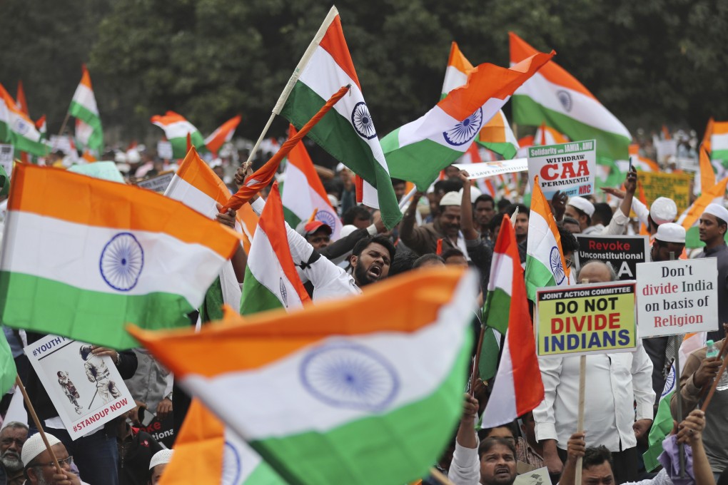 Indians hold national flags and placards during a protest against the new citizenship law in Bangalore, India, on December 23, 2019. Photo: AP