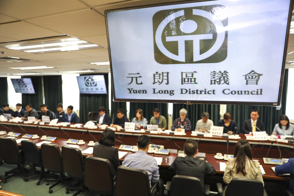 Yuen Long district councillors at a meeting on January 7. The district saw a chilling attack last July when a rod-wielding mob dressed in white attacked people, leaving before police belatedly arrived. Photo: Winson Wong