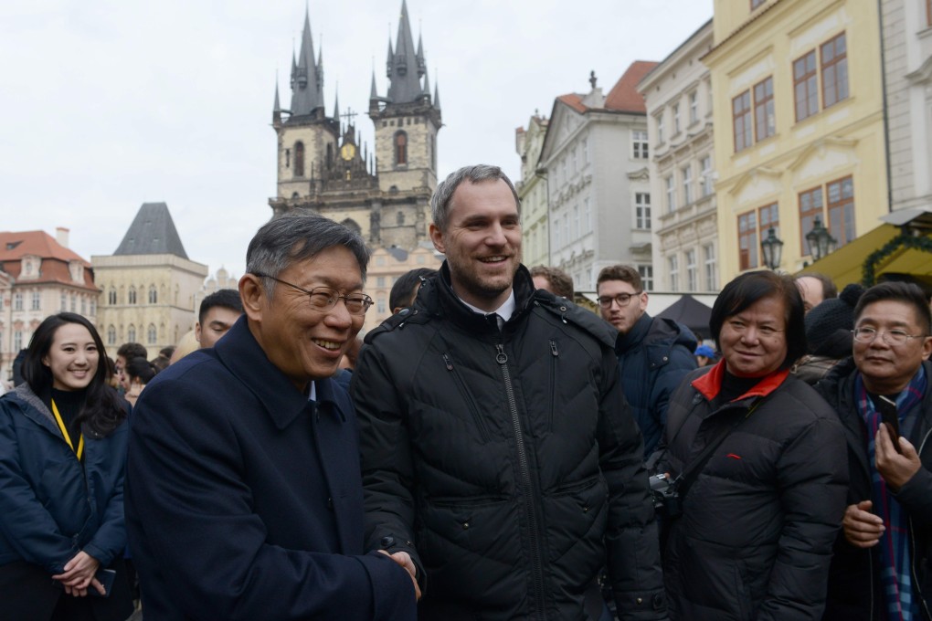 Prague mayor Zdenek Hrib shakes hand with his Taipei counterpart, Ko Wen-je, in the Old Town Square in Prague on Monday. Photo: AFP