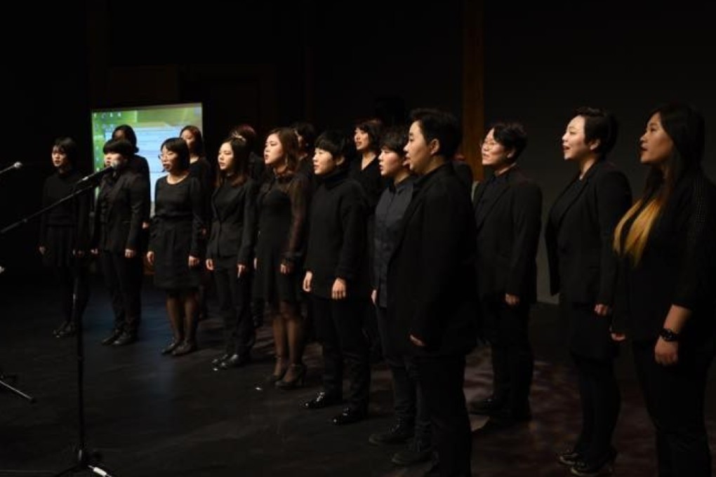 Members of South Korea’s Unnie Choir performs on stage. The choir sings about the joy and stigma of being gay in the socially conservative country.