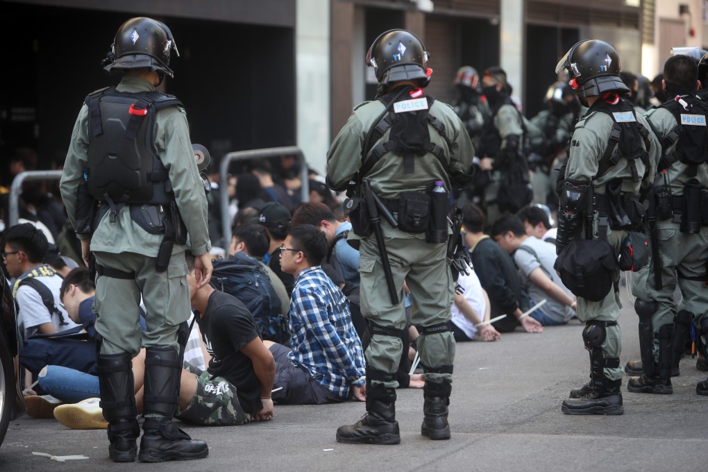 Police make dozens of arrests in Tsim Sha Tsui on November 18, during a days-long siege of Polytechnic University. Photo: Winson Wong