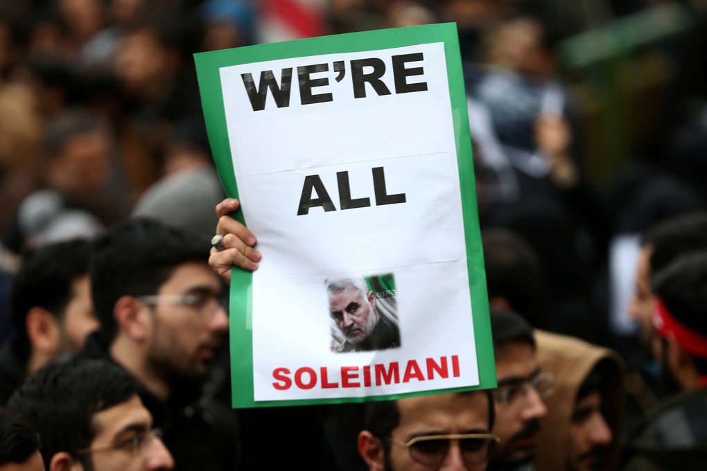 A mourner holds up a picture of Qassem Soleimani, the Iranian general killed in an air strike at Baghdad airport, during a rally in his memory in Tehran on January 4. Photo: Reuters