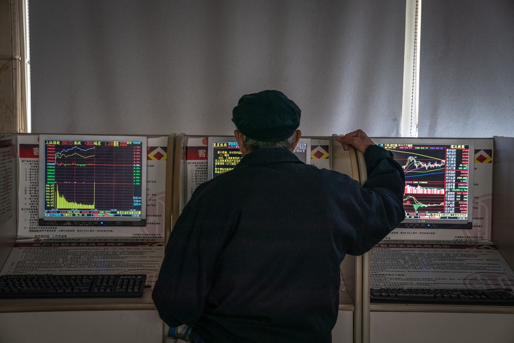 An investor monitors stock prices at a securities brokerage in Beijing. Photo: EPA-EFE