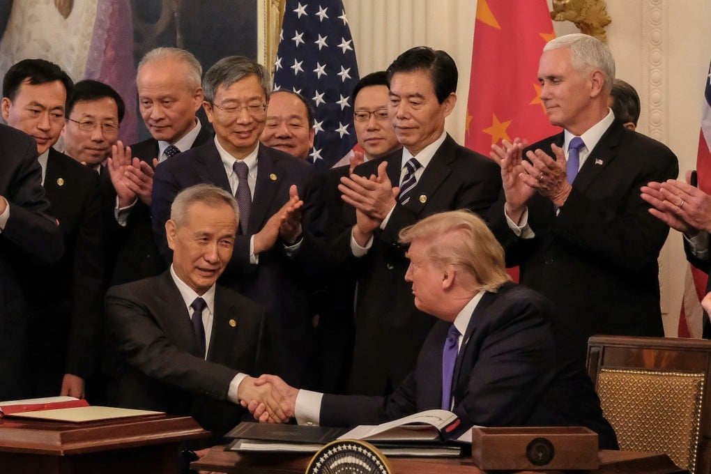 Chinese Vice-Premier Liu He and US President Donald Trump shake hands after signing the phase one trade deal at the White House in Washington on January 15. Photo: EPA-EFE