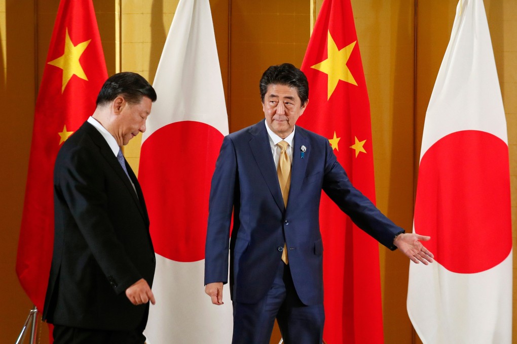 Japanese Prime Minister Shinzo Abe (right) greets Chinese President Xi Jinping at the start of their talks in Osaka, Japan, on June 27, 2019, ahead of a G20 summit. Photo: AFP
