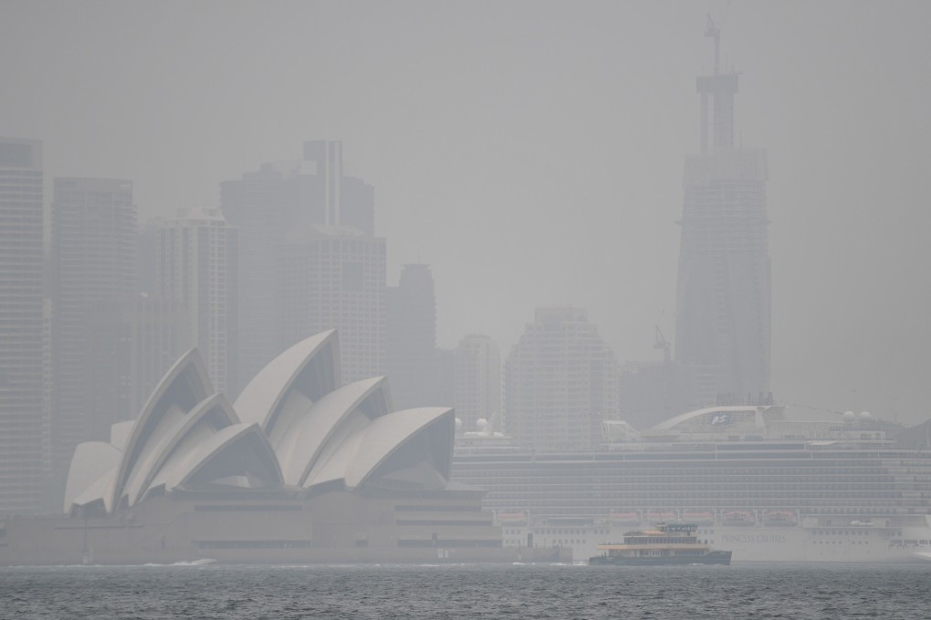 The Sydney Opera House is seen through smoke haze from bush fires in New South Wales. Images of the fires have deterred tourists from visiting Australia, especially over Lunar New Year. Photo: DPA