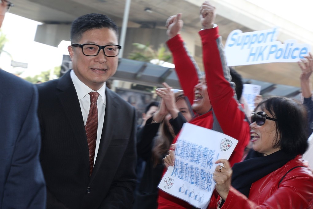 Supporters cheer police chief Chris Tang as he arrives at a Central and Western District Council meeting. Photo: Xiaomei Chen