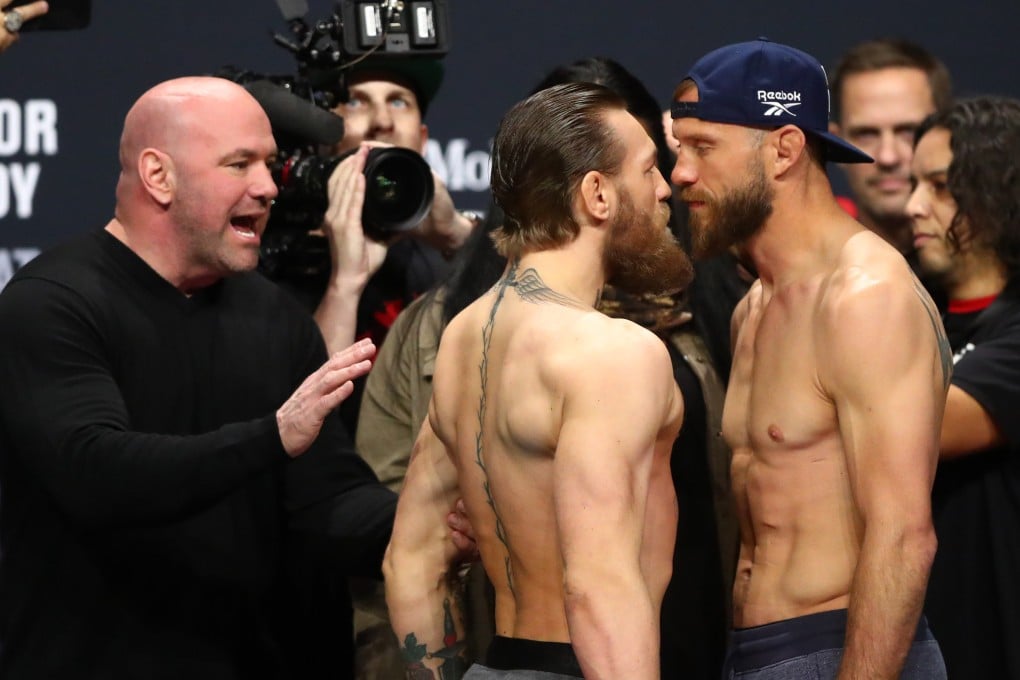 UFC president Dana White (left) reacts as Conor McGregor (centre) faces off against Donald Cerrone during the weigh-ins for UFC 246. Photo: USA TODAY Sports