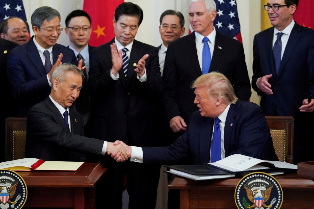 Chinese Vice-Premier Liu He and US President Donald Trump shake hands after signing a “phase one” trade pact in the White House on Wednesday. The negotiations have been cited as the reason why Washington has held off on actions pertaining to human rights in China. Photo: Reuters
