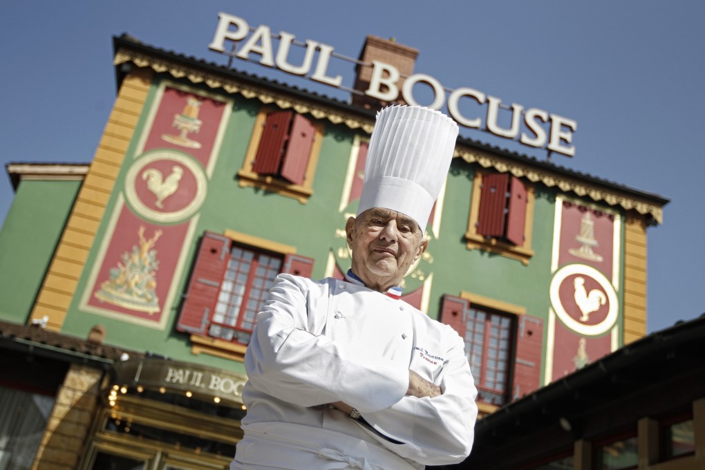 Chef Paul Bocuse poses outside his famed restaurant Auberge du Pont de Collonges in France in March 2011. Photo: AP